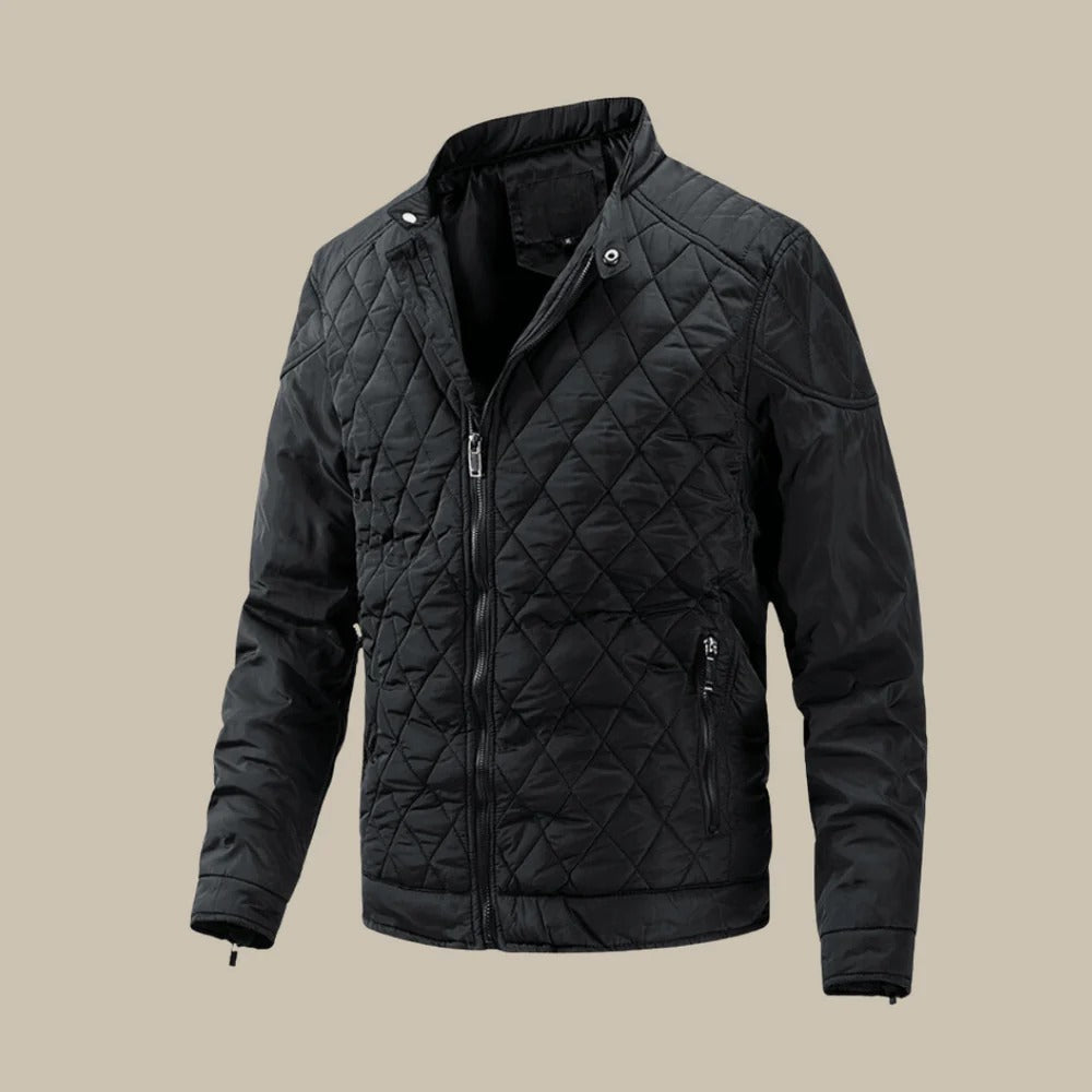 Męska pikowana kurtka o kroju slim fit, ze stójką, zapinana na zamek, z długimi rękawami i kieszeniami na zamek.